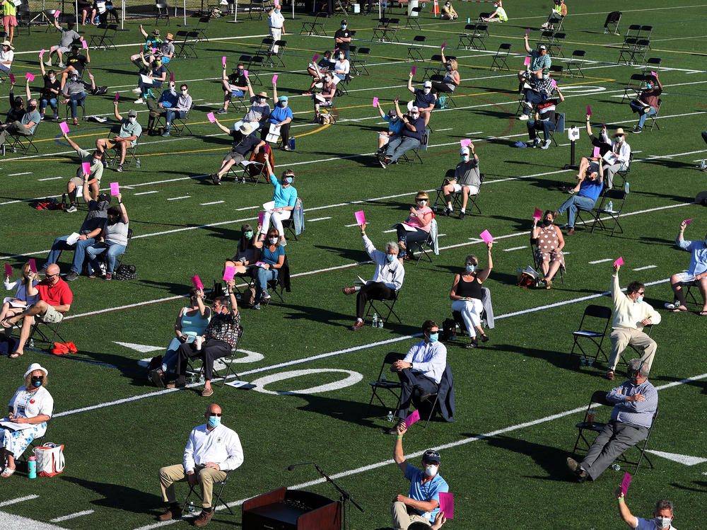 The annual town meeting in North Andover, Mass., which dates back to 1646, was held outside on June 16 on a high school football field to help keep participants a safe distance from each other.