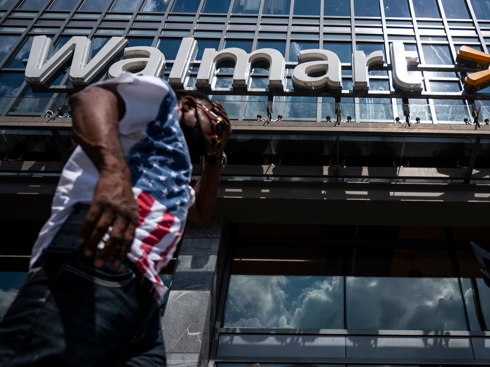 A man walks past a Walmart store in Washington, D.C. on July 15. Walmart said it was 