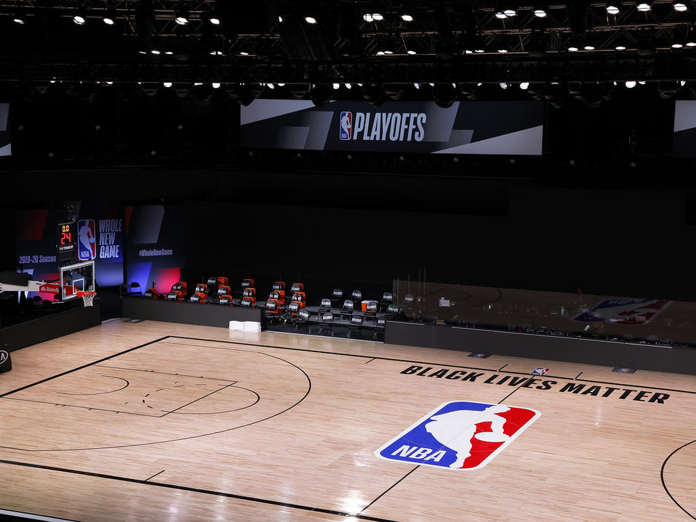 A basketball court is empty where the Milwaukee Bucks had been scheduled to play the Orlando Magic on Wednesday in Lake Buena Vista, Fla. The Bucks and other NBA teams boycotted their games following the police shooting of a Black man in Kenosha, Wis.