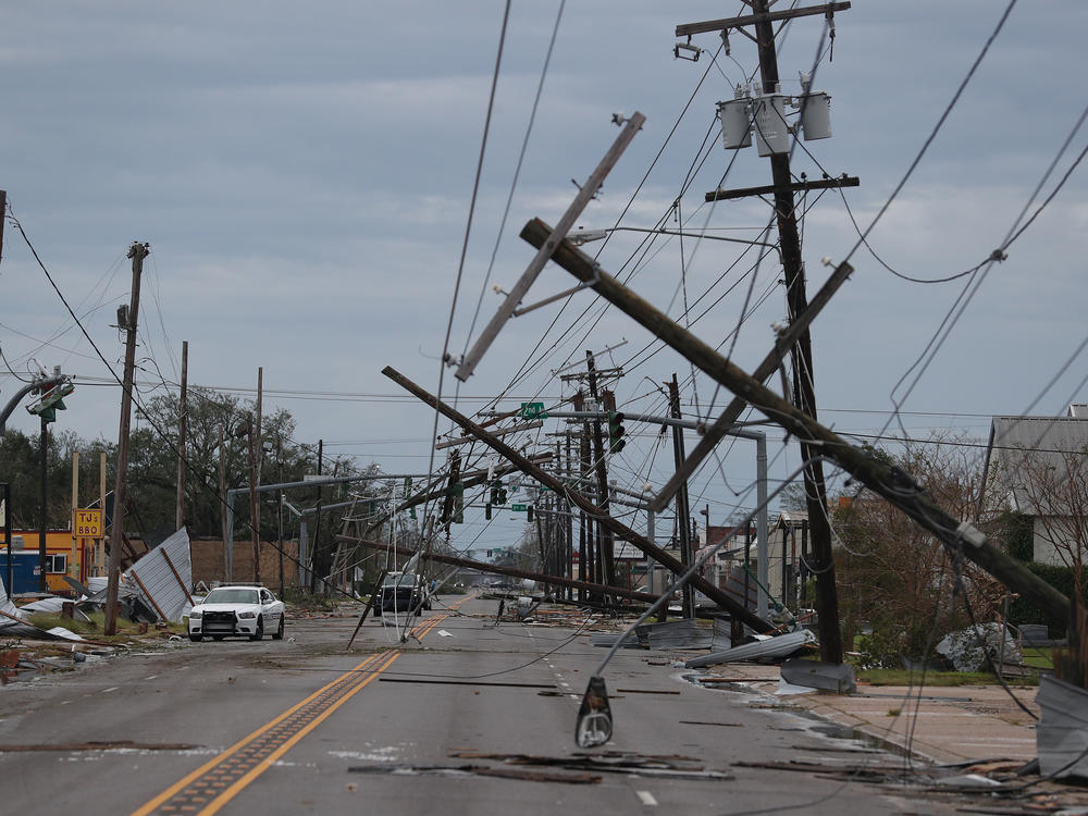 A street is seen strewn with debris and downed power lines after Hurricane Laura passed through Lake Charles, La., on Thursday.