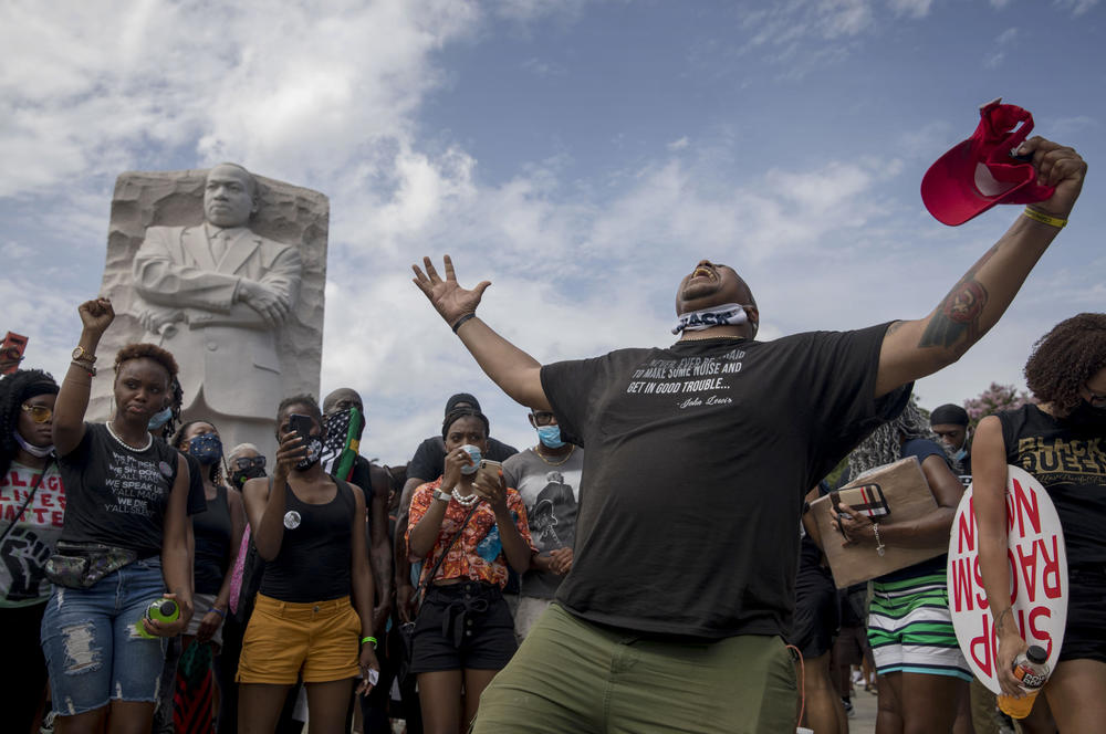 Julian Mack from Toledo, OH sings a song about loving being Black at the Martin Luther King Jr. monument. He is a candidate for city council in Toledo.