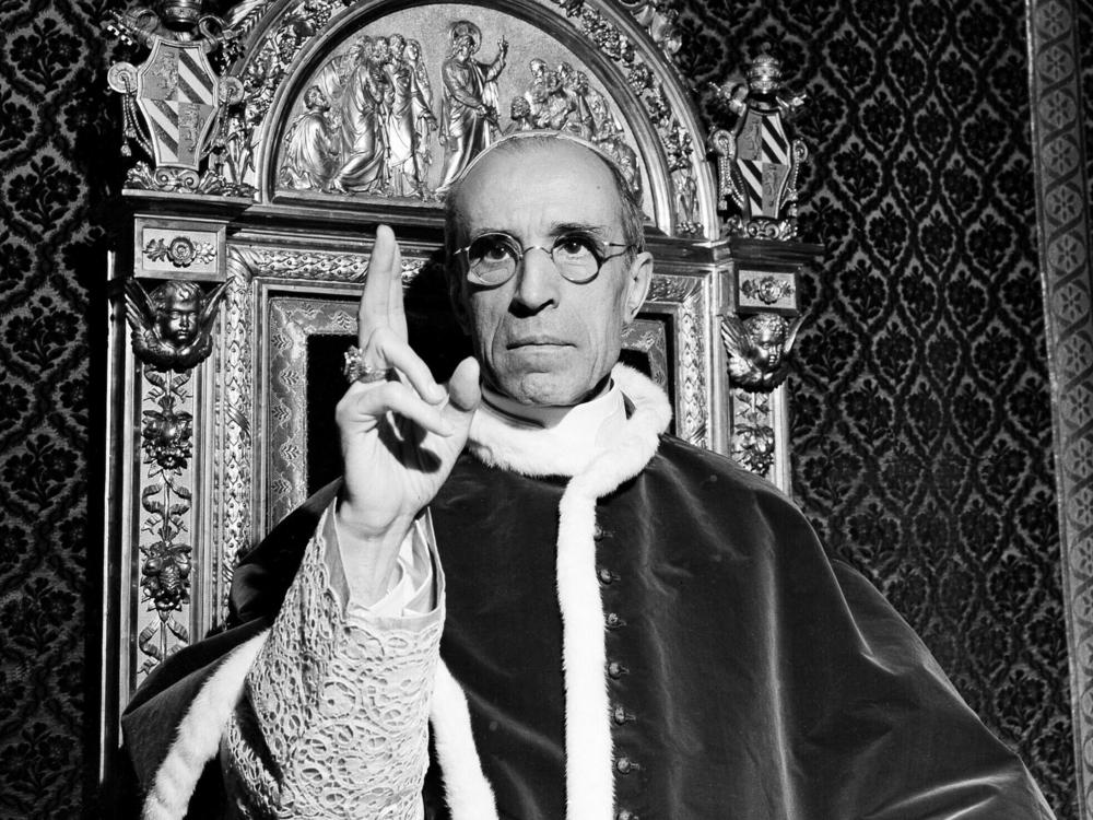 In this file photo dated September 1945, Pope Pius XII raises his right hand in a papal blessing at the Vatican. Pope Francis opened the Vatican archives on Pope Pius XII in March.