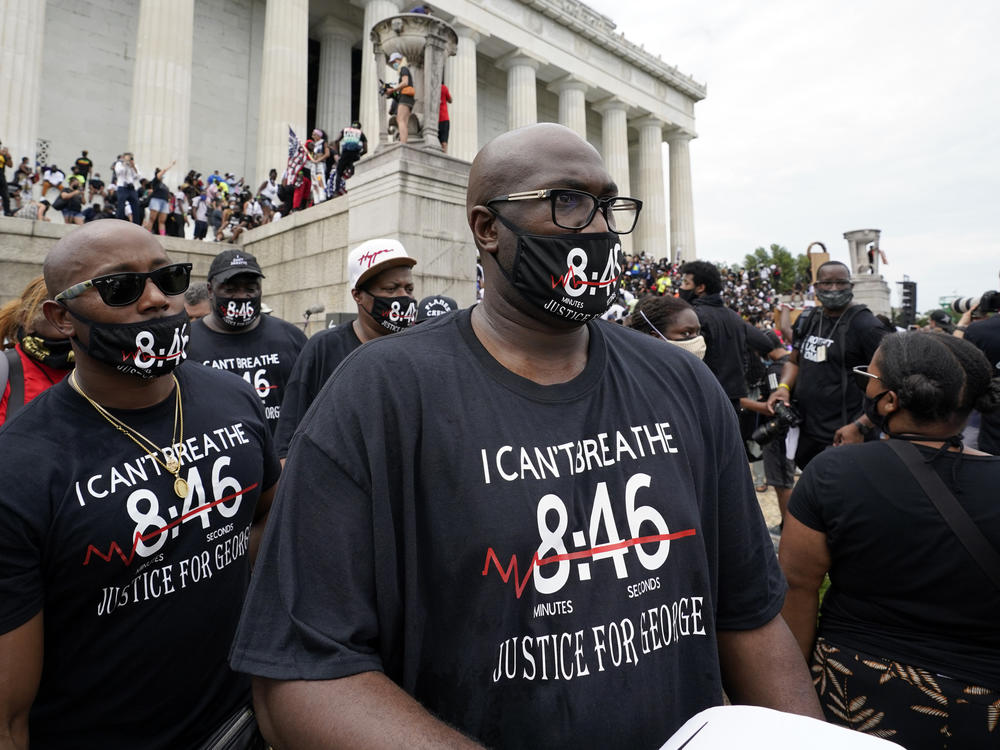 Philonise Floyd, right, brother of George Floyd, gets ready to march from the Lincoln Memorial to the Martin Luther King Jr. Memorial, during the March on Washington on Friday.