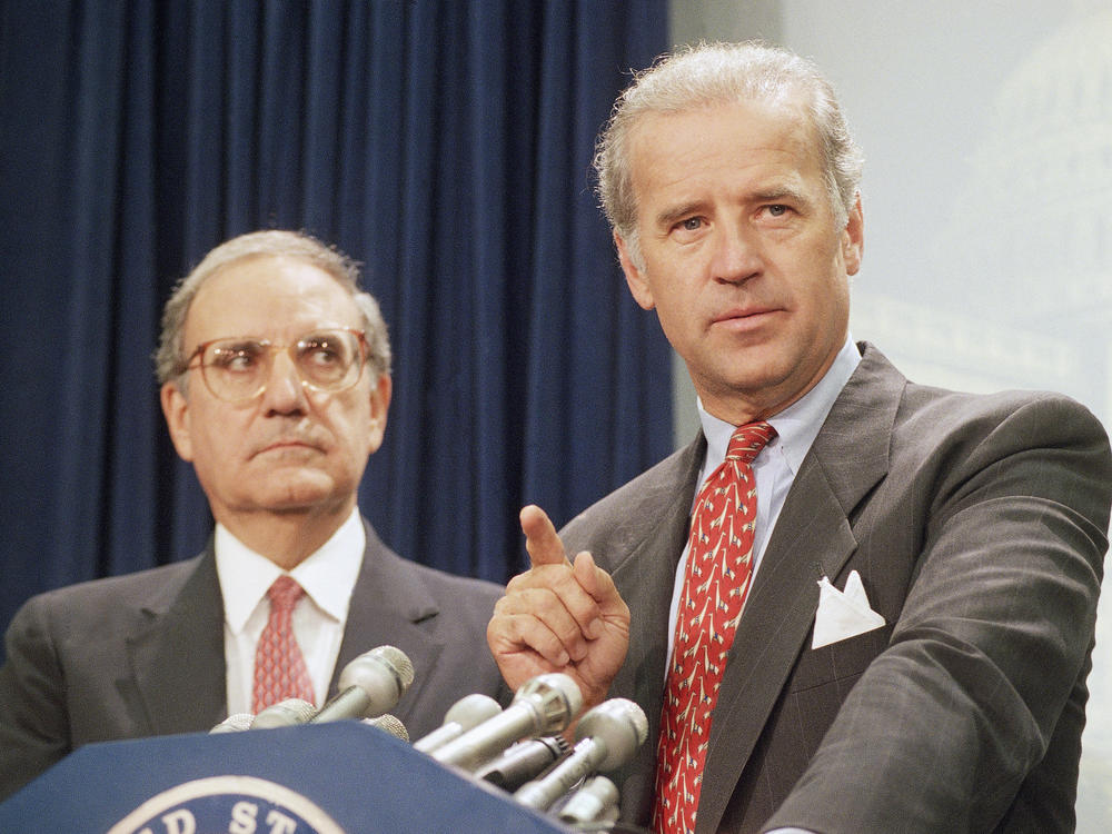 Then-Sen. Joe Biden (right) speaks at a Capitol Hill news conference in 1994 after the Senate voted on a major crime bill.