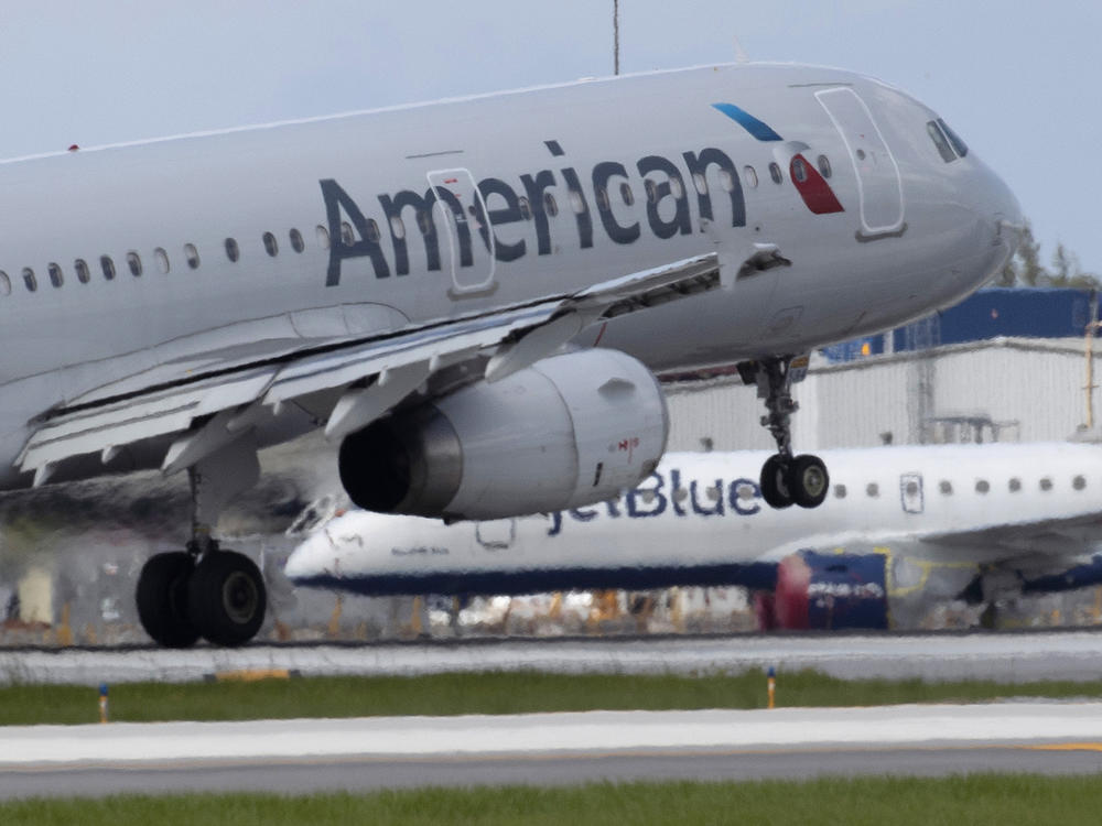 An American Airlines plane lands at the Fort Lauderdale-Hollywood International Airport on July 16, 2020. Air traffic has rebounded a bit but it's way below pre-coronavirus levels.