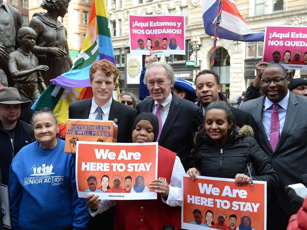 U.S. Rep. Joe Kennedy III (D-Mass.), center left, and  Sen. Edward Markey (D-Mass.), center right (R) during a 2017 protest against Trump administration immigration policies. The two lawmakers face each other in a Democratic primary this Tuesday.