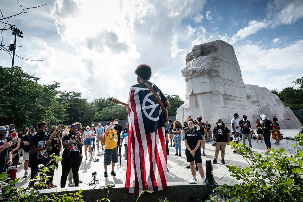 A musician plays a tune at the Martin Luther King Jr. Memorial after the official program.