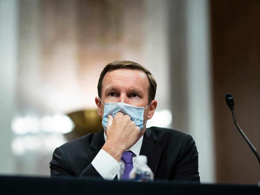 In his new book, Sen. Chris Murphy, D-Conn., <em></em>outlines the history of the Second Amendment and why gun violence is as bad as it is today. Above, Murphy listens during during a Senate hearing on June 30, 2020.
