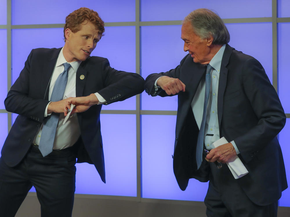 Rep. Joe Kennedy III (left) bumps elbows with Sen. Ed Markey after their Democratic Senate primary debate on June 1 in Springfield, Mass.