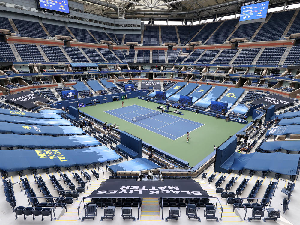 Karolina Pliskova of the Czech Republic and Anhelina Kalinina of Ukraine play their first-round match at a mostly empty Arthur Ashe Stadium on Monday. This year's U.S. Open is taking place without spectators because of the coronavirus pandemic.