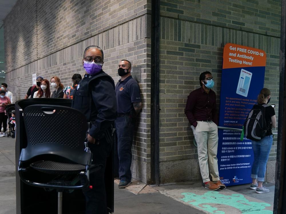 People stand in line for free coronavirus testing this month at Bellevue Hospital in New York City. The daily number of new coronavirus cases reported in the U.S. has remained stubbornly high.
