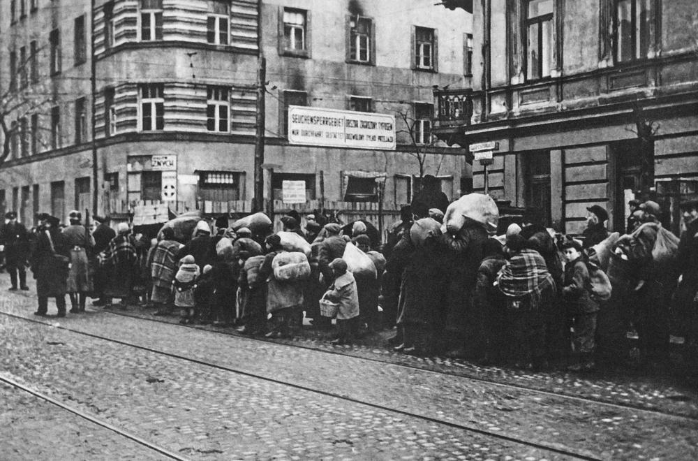 The forced resettlement of Jews from villages and small cities in Warsaw District to the Warsaw ghetto. This photo was taken near the crossing of Zelazna and Solidarnosci streets.