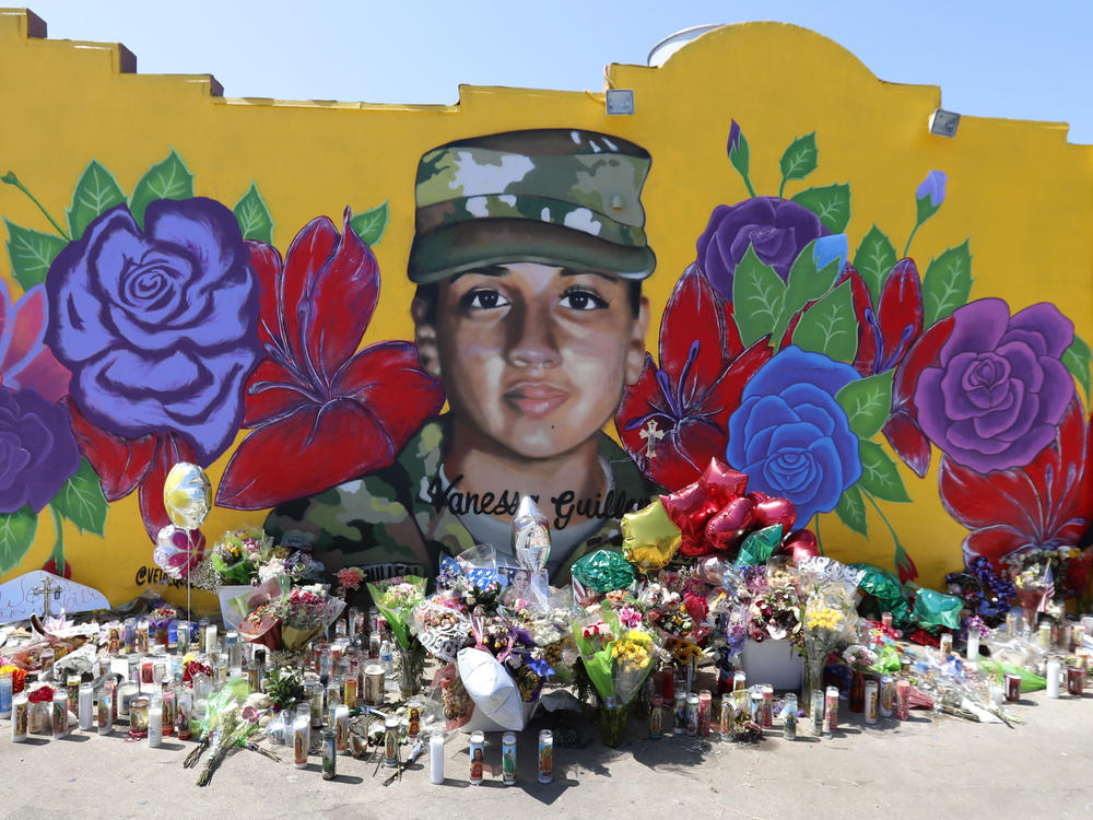 A mural of slain Army Spc. Vanessa Guillén in the south side of Fort Worth, Texas. The Army says it will expand its inquiry into the killing of Guillén, who is one of a string of disappearances and deaths at the Texas post.