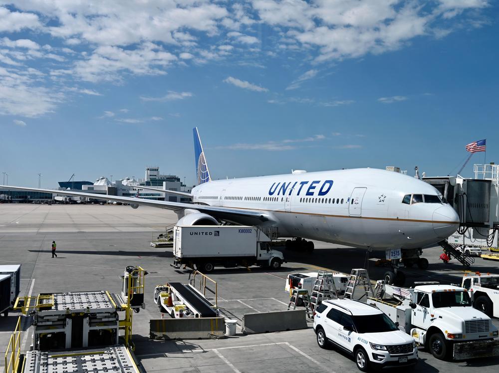 A United Airlines plane sits at the gate at Denver International Airport on July 30. The airline industry has been hit hard by the coronavirus pandemic.