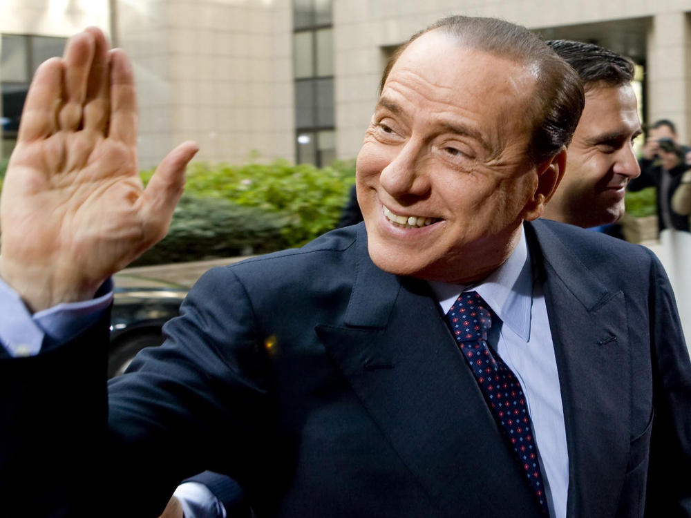 Former Italian Prime Minister Silvio Berlusconi waving at  members of the media in Rome, Italy, in 2011. Berlusconi's staff announced Wednesday that he has tested positive for coronavirus but is showing no symptoms at present.