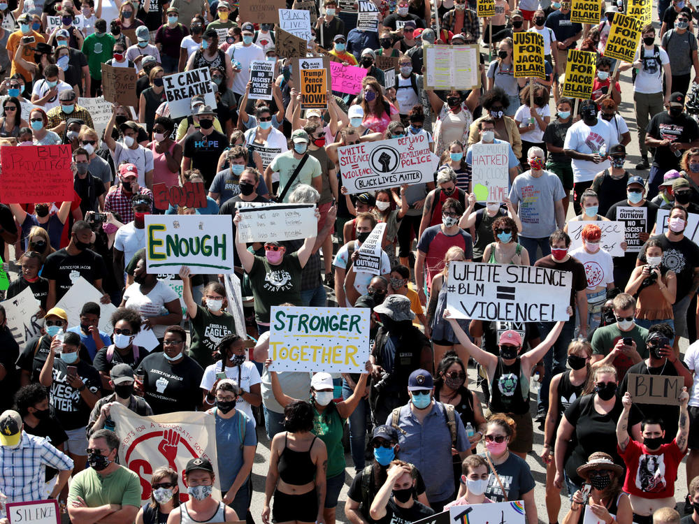 People march in support of Jacob Blake and his family to the Kenosha County Courthouse in Kenosha, Wis., in August.