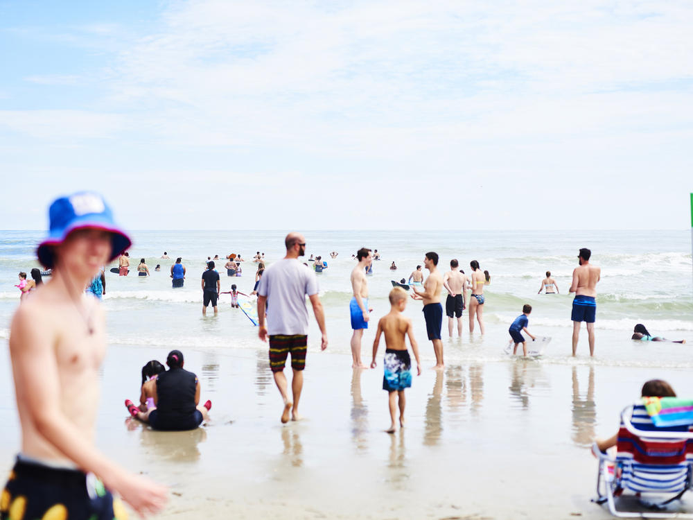 People roamed the beach in Ocean City, N.J, at the start of August. As Labor Day weekend arrives, Dr. Anthony Fauci, director of the National Institute of Allergy and Infectious Diseases, says Americans should remain vigilant to avoid another surge in coronavirus infection rates.