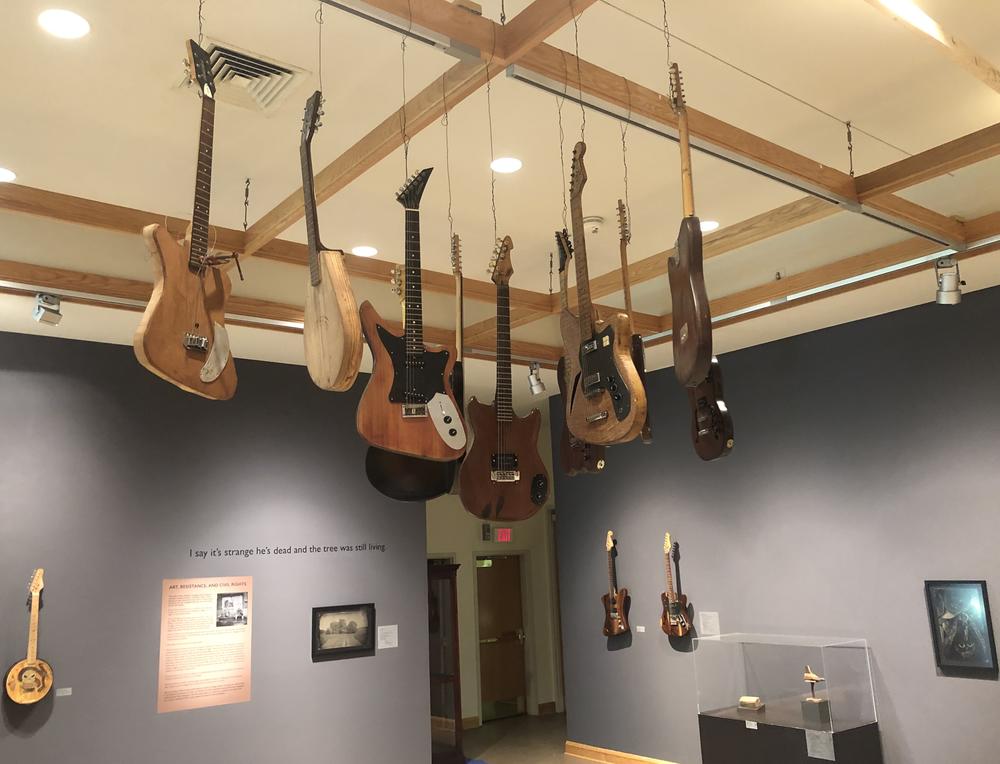 Freeman Vines' guitars hanging in the Greenville Museum of Art.