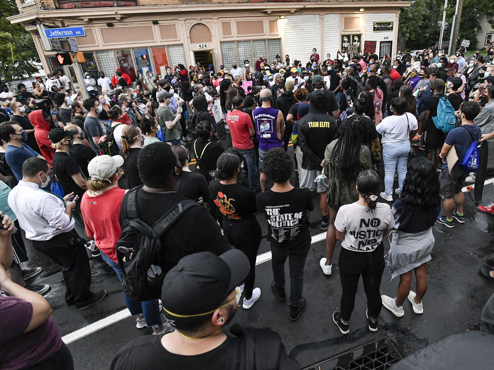 Protesters gather Wednesday in Rochester near the site where police officers restrained Daniel Prude in March. Prude died a week after the encounter with police.