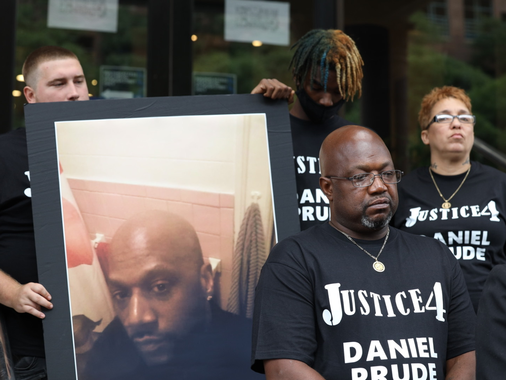 Joe Prude announces plans to sue over the death of his brother, Daniel Prude, while outside Rochester, N.Y., City Hall on Wednesday.