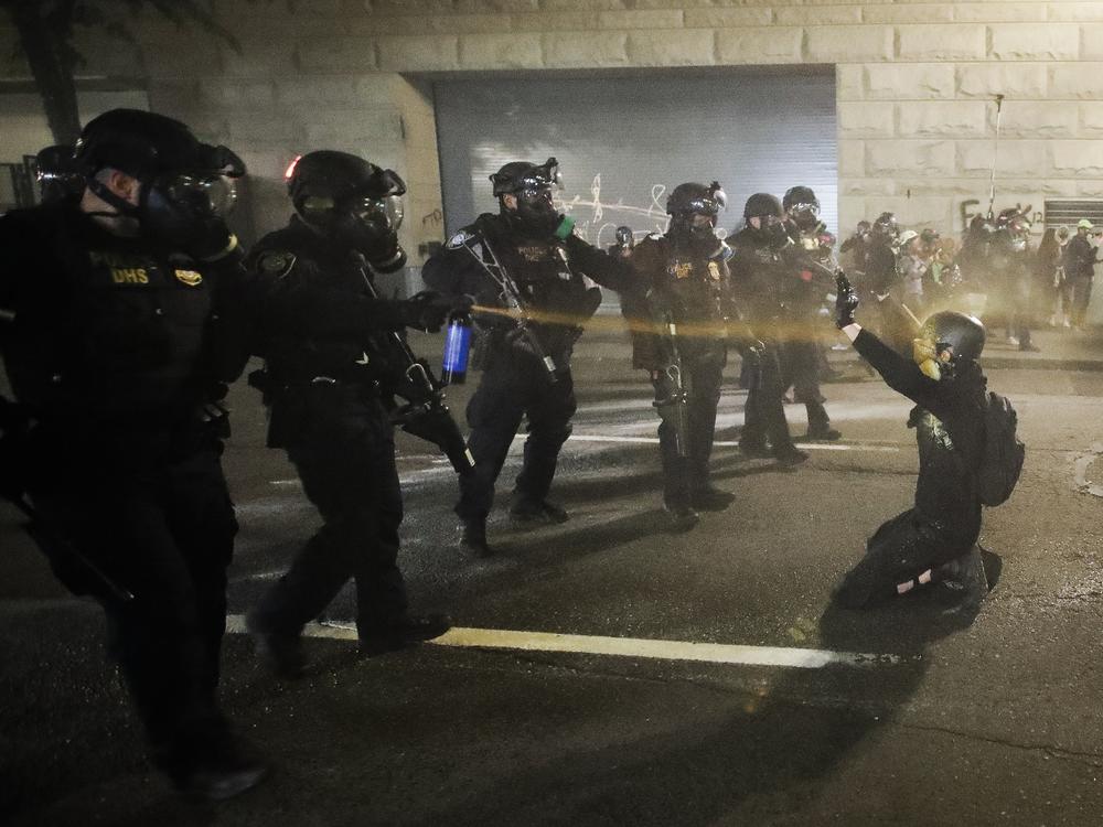 A demonstrator is pepper-sprayed July 30 shortly before being arrested during a Black Lives Matter protest at the Mark O. Hatfield United States Courthouse in Portland, Ore.