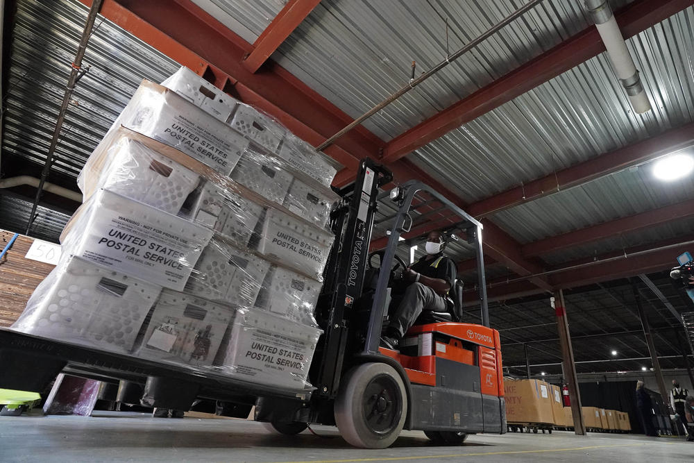 A forklift operator loads absentee ballots for mailing Thursday at the Wake County Board of Elections in Raleigh, N.C. North Carolina is scheduled to begin sending out more than 600,000 requested absentee ballots to voters on Friday.