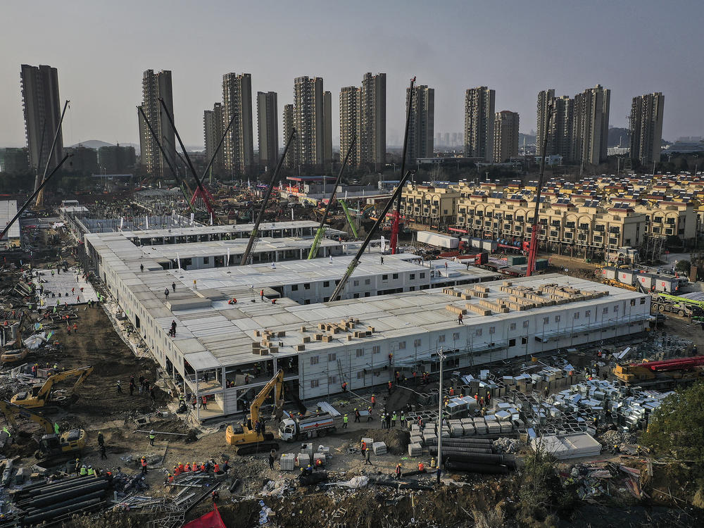 On Jan. 23, workers started building the Huoshenshan hospital for COVID-19 patients in Wuhan, China. The photo above was taken on Jan. 30. Construction was done on Feb. 2, and the 1,000-bed hospital opened on Feb. 3. Today it stands empty of patients.