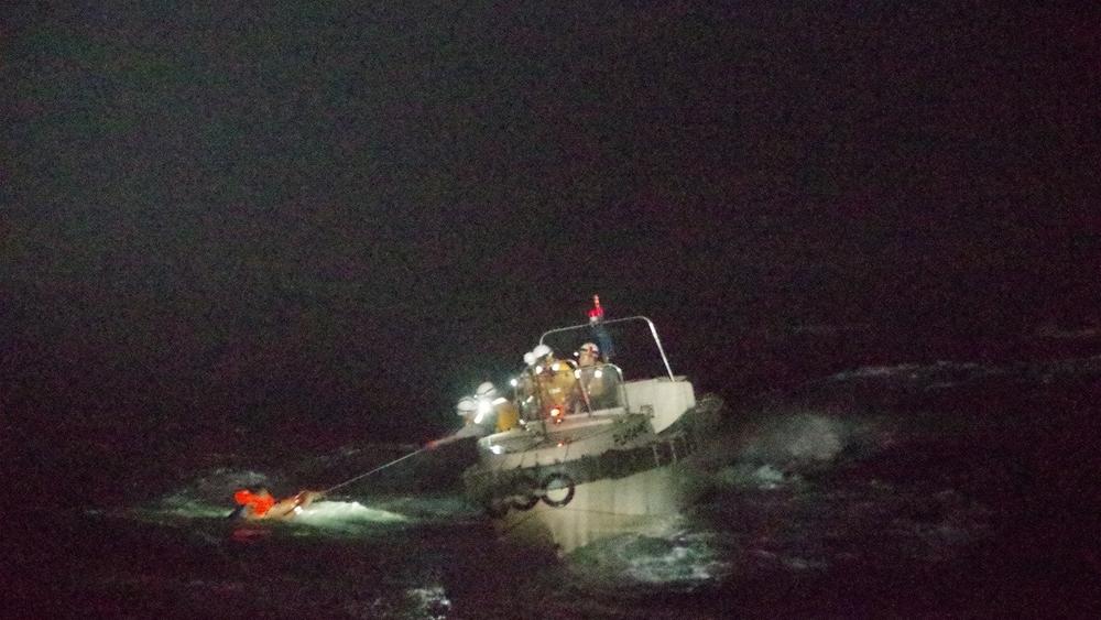Edvardo Sareno, a 45-year-old chief officer from the Philippines of the capsized ship The Gulf Livestock 1, is seen being rescued by Japan's coast guard on Wednesday. So far, he is one of two survivors from the vessel's crew of 43.