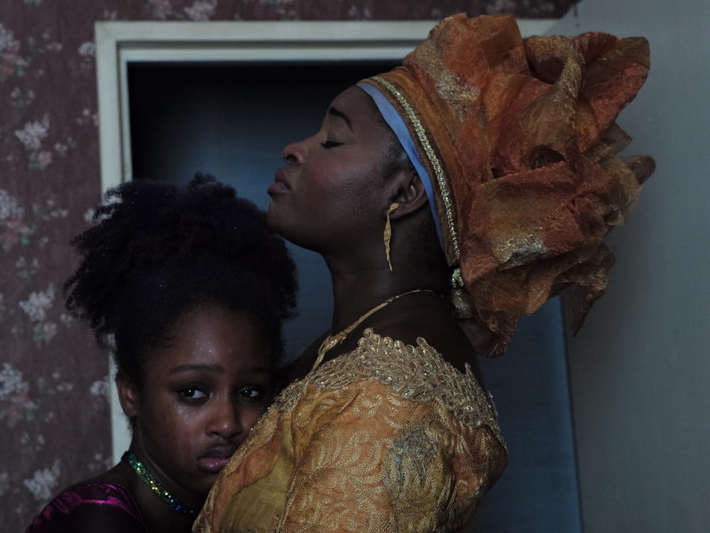 Amy (left), played by Fathia Youssouf, and her mother Mariam, played by Maïmouna Gueye, in a still from the film, <em>Cuties</em>.