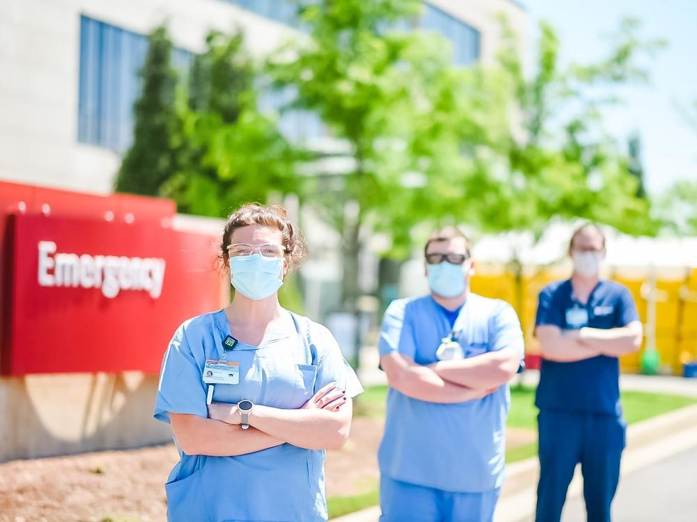 A triage team screens patients outside the Emergency Department at Owensboro Health. The hospital lost two-thirds of its revenue while elective surgeries were halted, but it didn't lay off any workers.