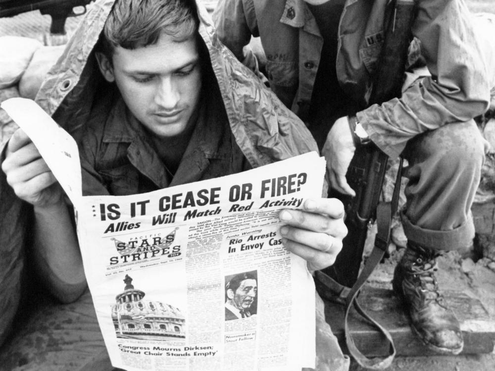 U.S. troops in the Vietnam War read the <em>Stars and Stripes</em> newspaper in 1969. The Pentagon plans to shut down the paper, for generations aimed at U.S. military personnel, at the end of this month.