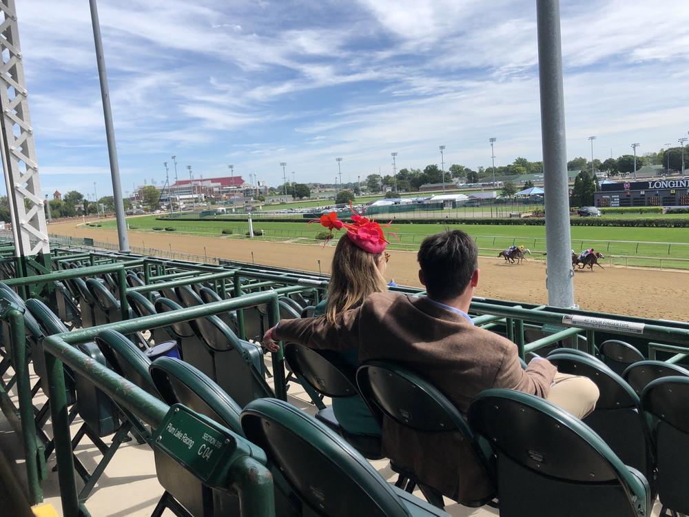 Spectators in an otherwise empty grandstand watch the Kentucky Oaks at Churchill Downs on Sept. 4. Oaks is typically a daylong party, a kick-off to the Kentucky Derby, which runs the following day.