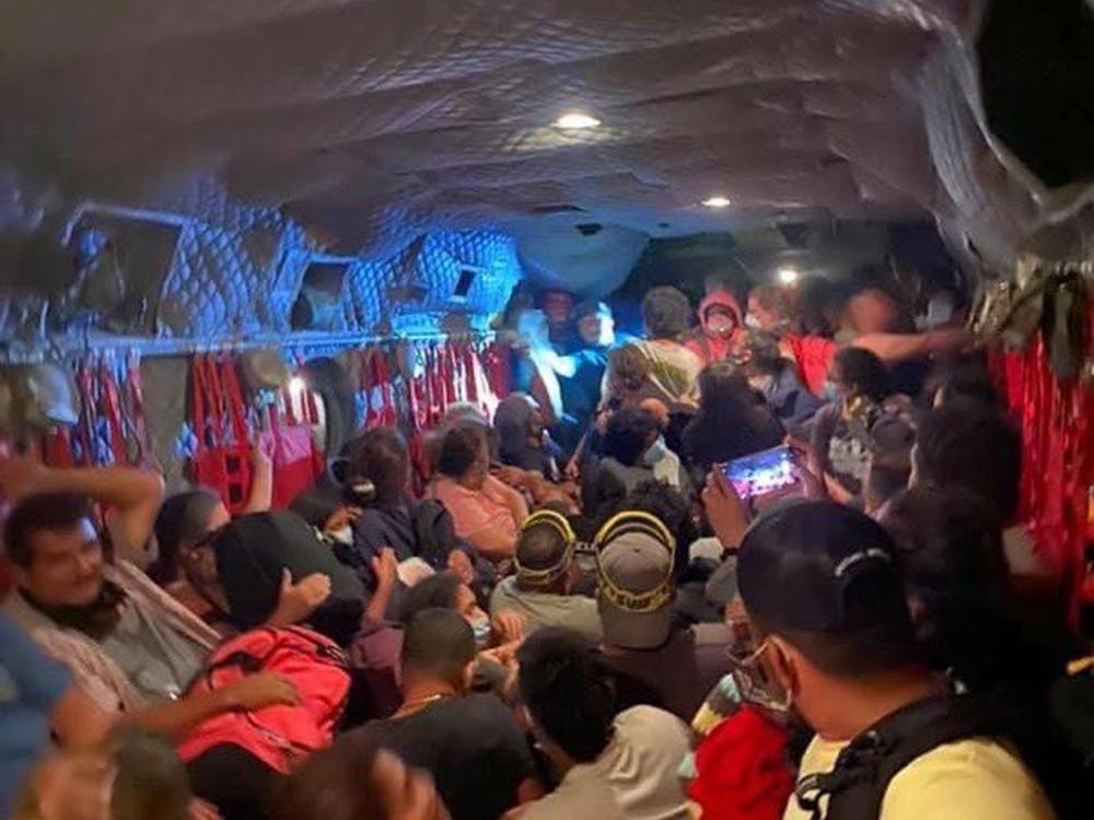 Dozens of people are evacuated to safety on a California National Guard Chinook helicopter on Saturday after the Creek Fire in central California left them stranded. More than 200 people were airlifted to safety after the fast-moving wildfire trapped them in a popular camping area in Sierra National Forest.