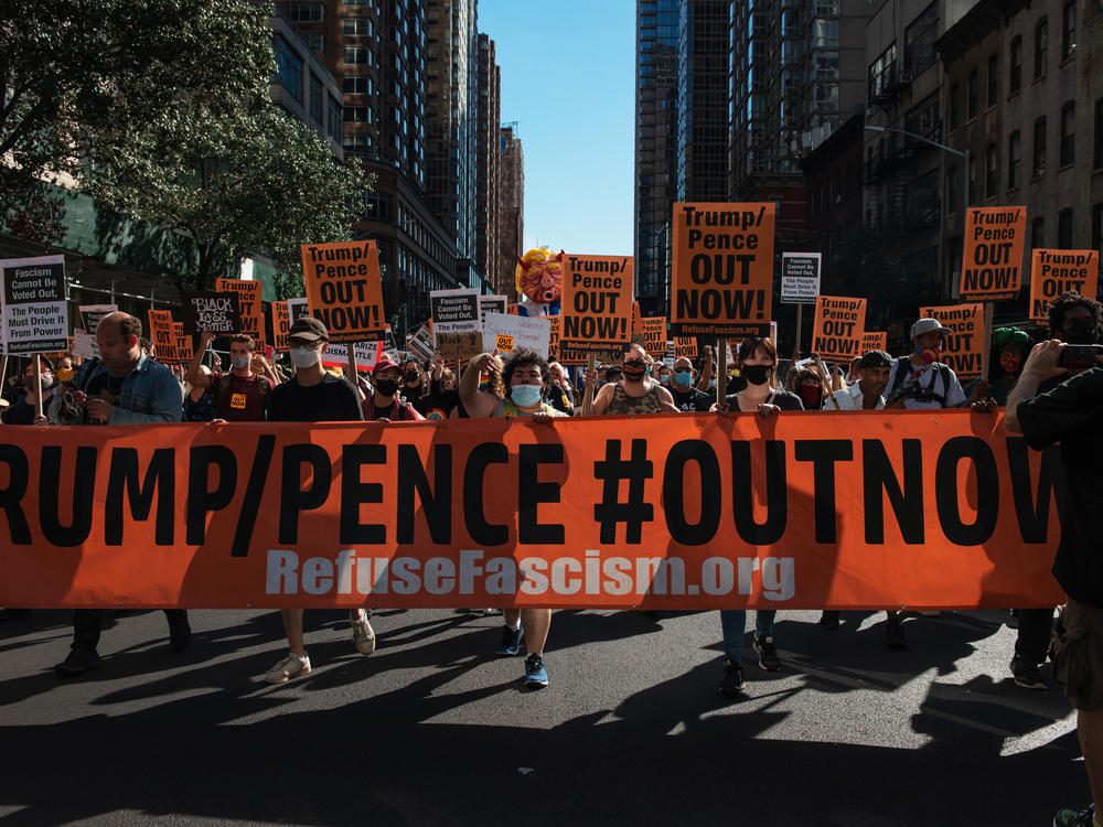 People march during the nationwide protest demanding the end to the Trump administration in New York City on Saturday. Protesters have often accused President Trump of being fascist.
