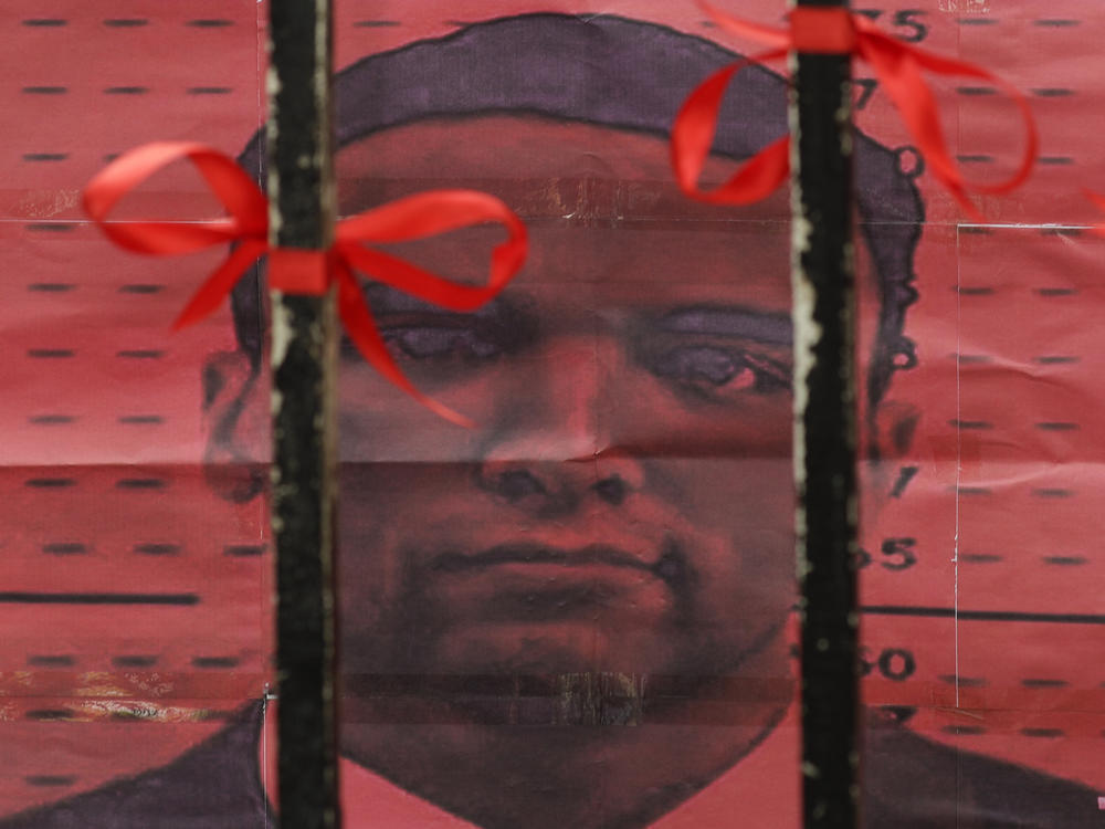 U.S. Marine Lance Cpl. Joseph Scott Pemberton is seen from behind the gates of the Department of Justice in Manila, Philippines. Philippines President Rodrigo Duterte granted Pemberton a pardon following his conviction in the 2014 killing of a transgender Filipino woman.