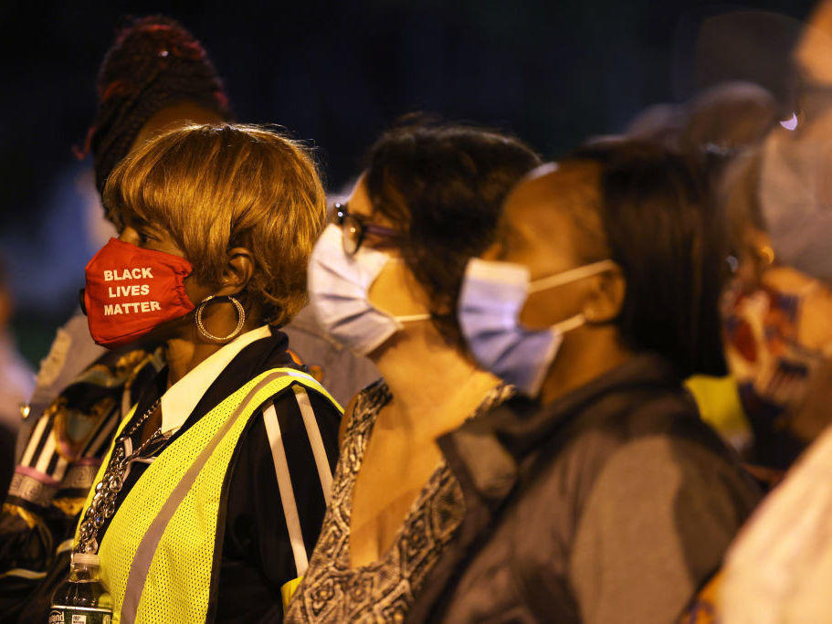 Elders stand on the front line in a march for Daniel Prude on Sunday in Rochester, N.Y. Prude died in March a week after police pinned him to the ground. It was the fifth consecutive night of protesting since the release of police body-camera footage of Prude's arrest.