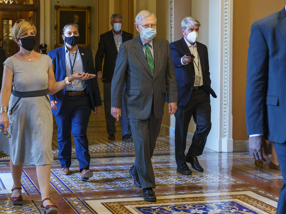 Senate Majority Leader Mitch McConnell of Ky., center, introduced a targeted coronavirus relief bill and said he planned a vote this week on it.