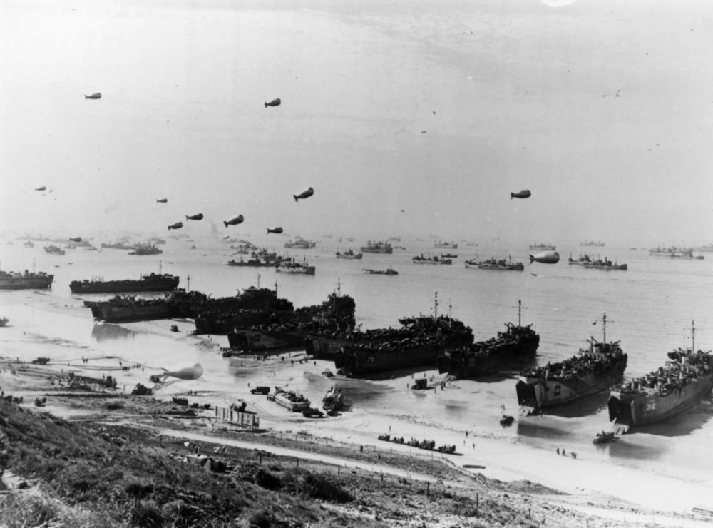 Barrage balloons and ships at Omaha Beach during the Allied assault in Normandy, France.