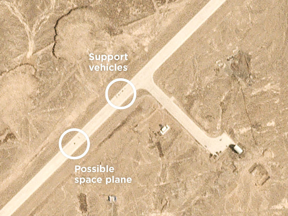 A photo snapped by a passing commercial satellite shows objects on the airstrip at 10:11 a.m. local time on Sept. 6, just minutes after a scheduled landing would have occurred.