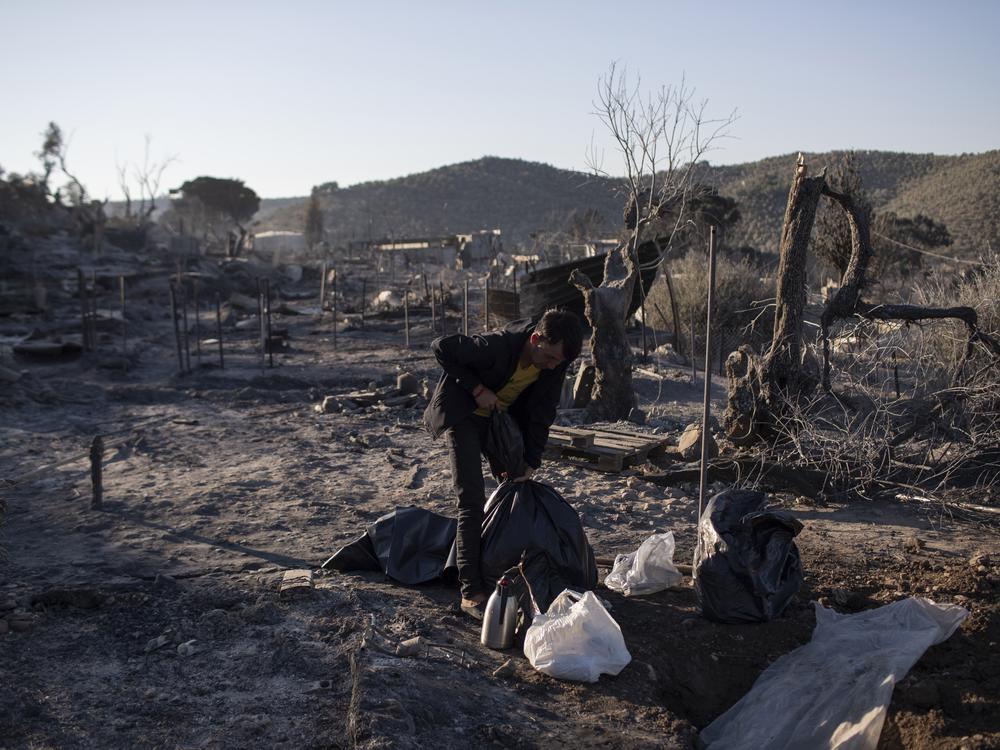 A man in the burned Moria refugee camp in Lesbos, Greece, Thursday. A second fire the island's notoriously overcrowded Moria refugee camp destroyed nearly everything that had been spared in an earlier blaze, Greece's migration ministry said Thursday, leaving thousands more in need of emergency housing.
