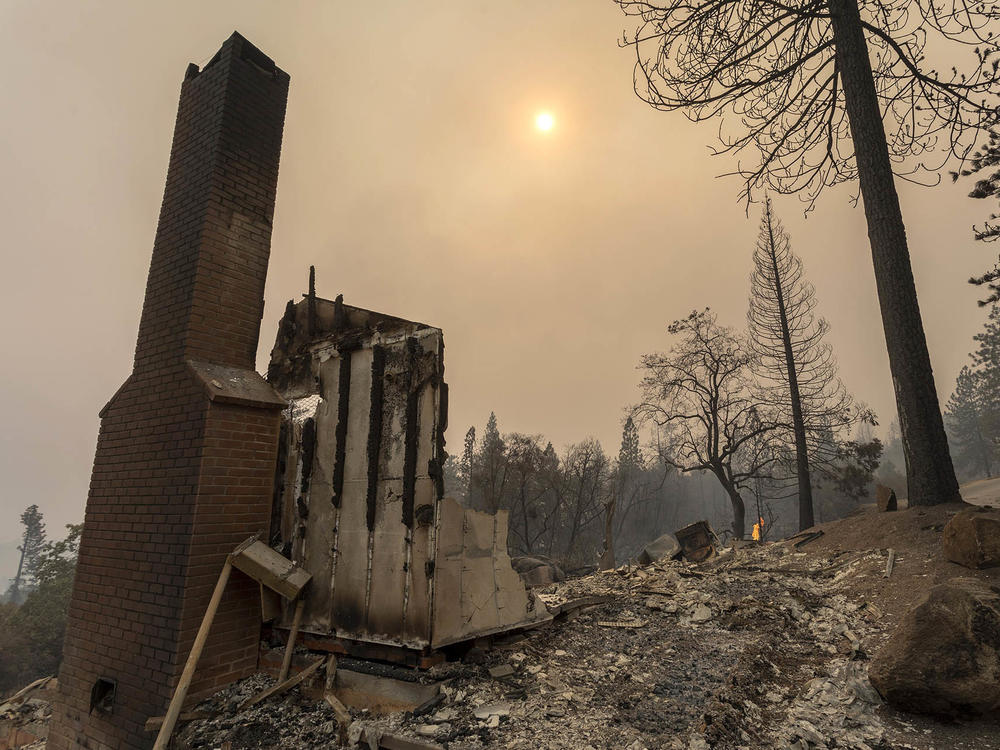Retrofitting homes with fire-resistant materials can improve the chances they survive wildfires. Here, a home is destroyed after the Creek Fire swept through the area near Shaver Lake, Calif.