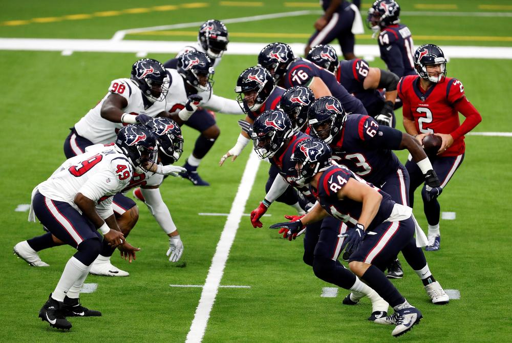 Houston Texans quarterback AJ McCarron (2) runs a play during an NFL training camp football practice Thursday, Aug. 27 in Houston.