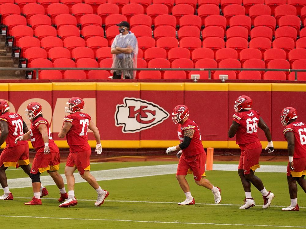 In this Aug. 29 file photo, Kansas City Chiefs players run during NFL football training camp at Arrowhead Stadium in Kansas City, Mo.