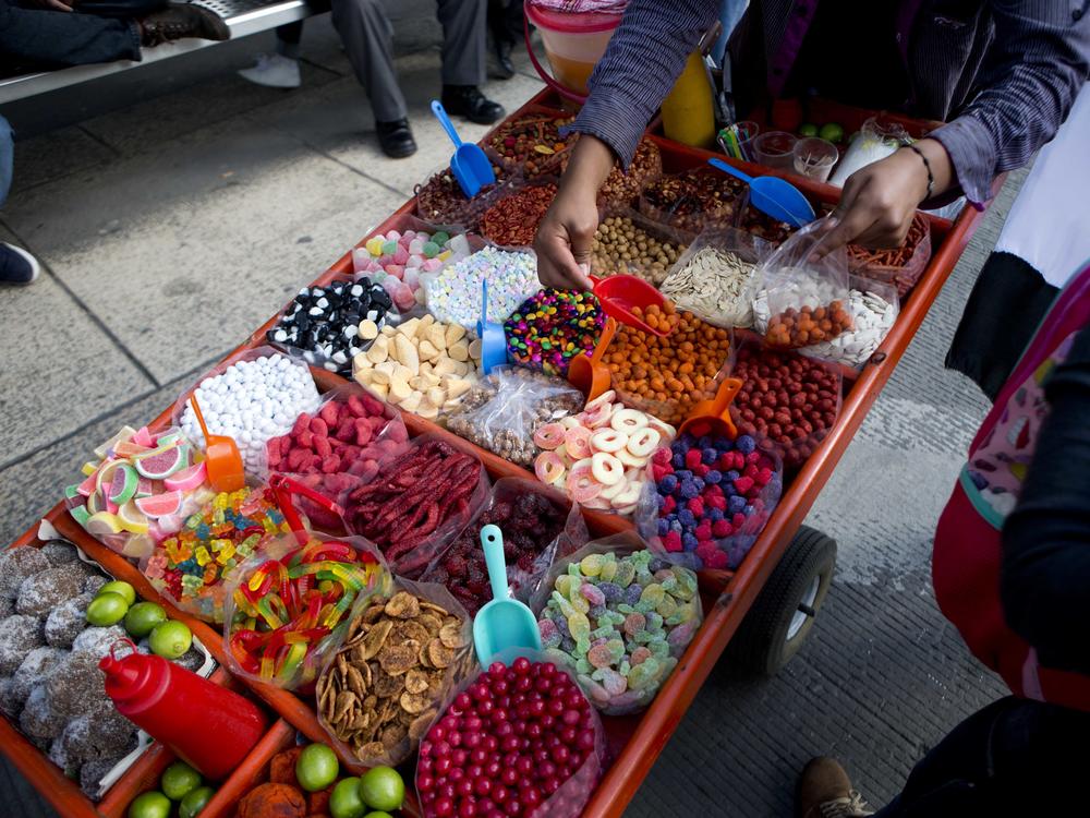 A street vendor sells sweet snacks in Mexico City in 2016. Several states are pushing to ban the sale of junk food and soda to children to improve the population's nutrition levels.