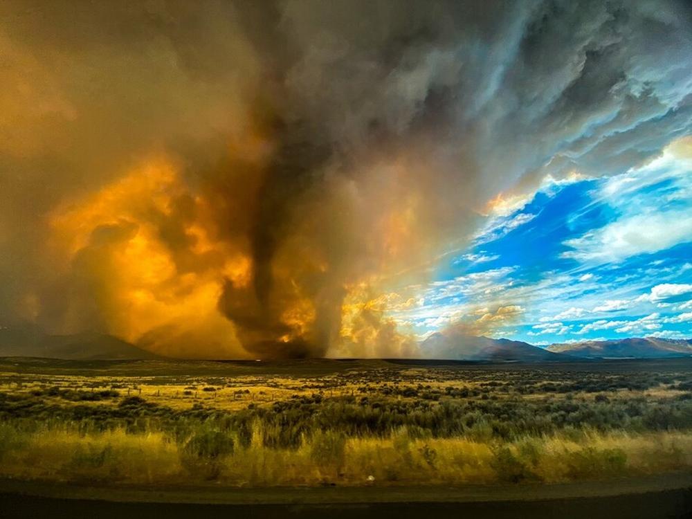 A funnel appears in a thick plume of smoke from the Loyalton Fire last month in Lassen County, Calif. It is one of many wildfires to have hit the state recently.