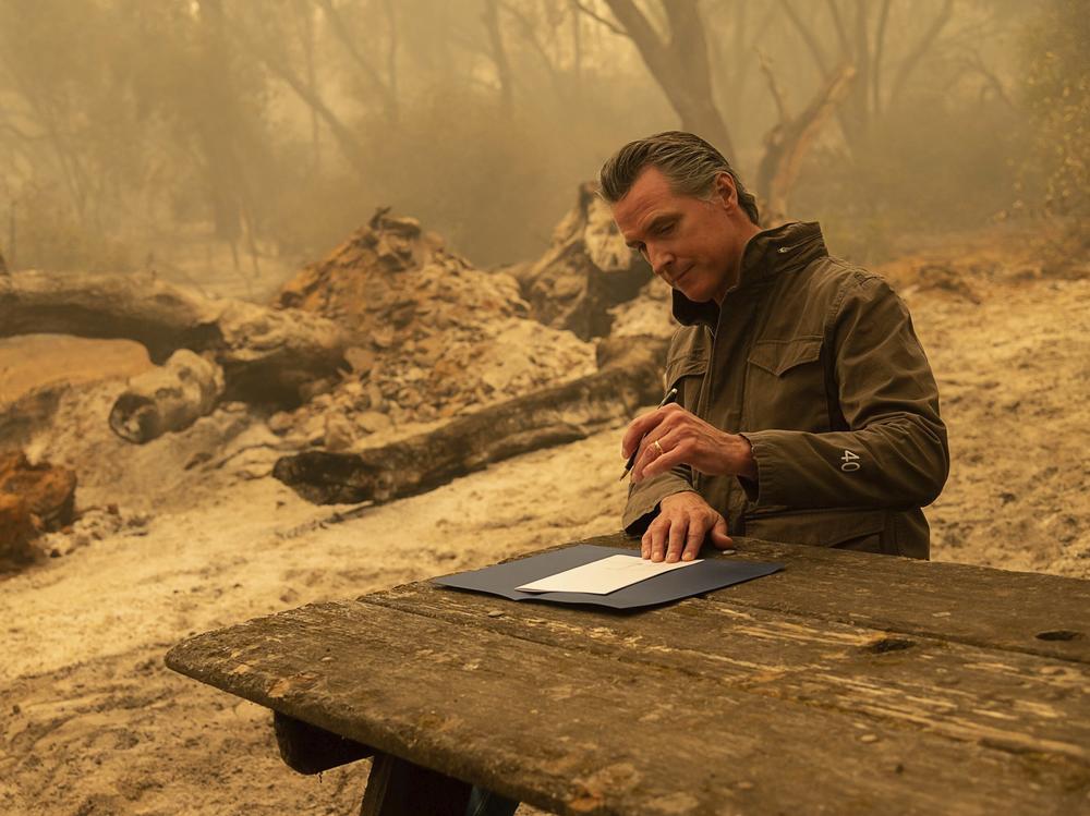 California Gov. Gavin Newsom signs Assembly Bill 2147 after he toured the North Complex Fire zone on Friday.  The bill allows inmates who have worked as firefighters to ask the court to dismiss their charges to make it easier for them to find a job once they are released. People convicted of certain violent or sex crimes would not be eligible.