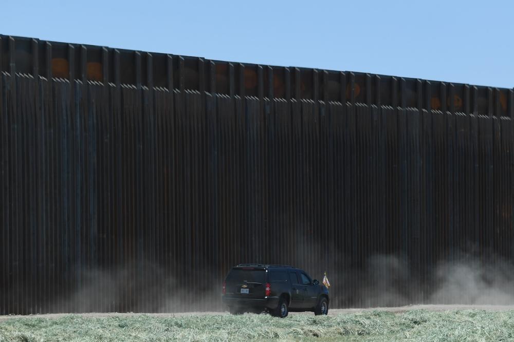 A car with President Trump drives after participating in a ceremony commemorating the 200th mile of border wall at the international border with Mexico in San Luis, Ariz., on June 23.