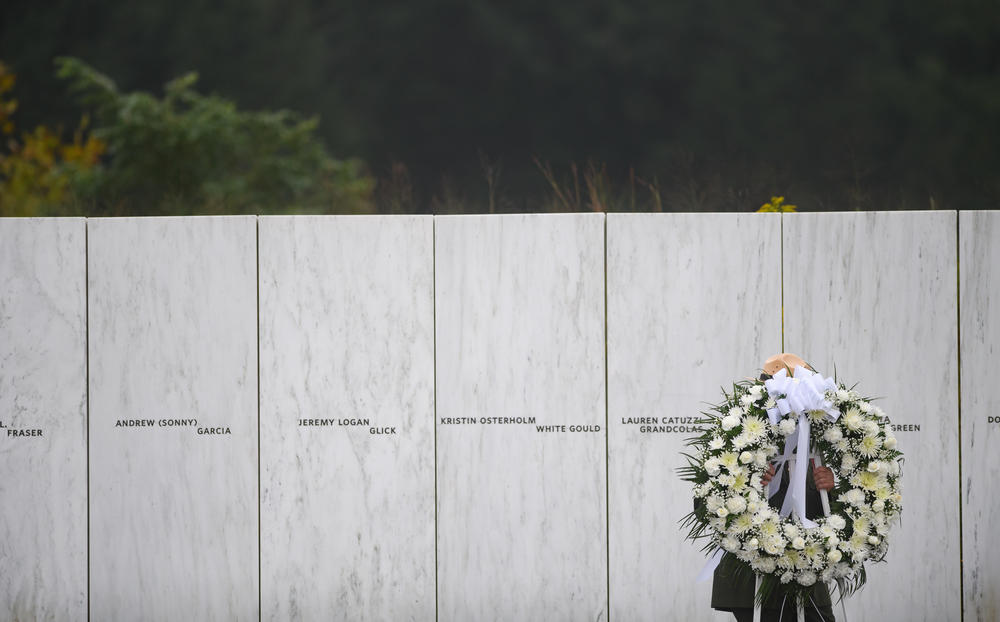 A U.S. Park Ranger moves a memorial wreath prior to President Trump delivering remarks at the Flight 93 National Memorial on Friday.