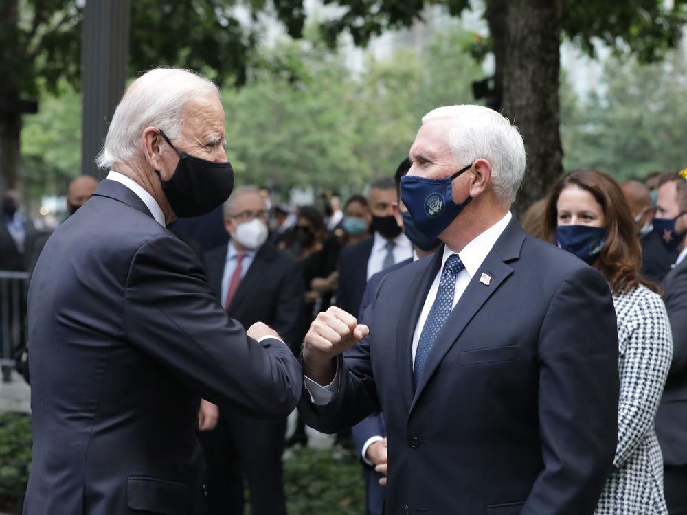 Democratic presidential candidate Joe Biden greets Vice President Pence at the 9/11 Memorial in New York to commemorate the 19th anniversary of the Sept. 11 attacks on Friday.