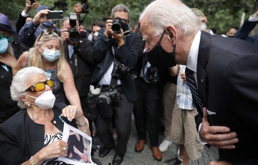 Democratic presidential candidate Joe Biden greets Maria Fisher, 90, whose son Andrew Fisher was killed in the World Trade Center's north tower 19 years ago.